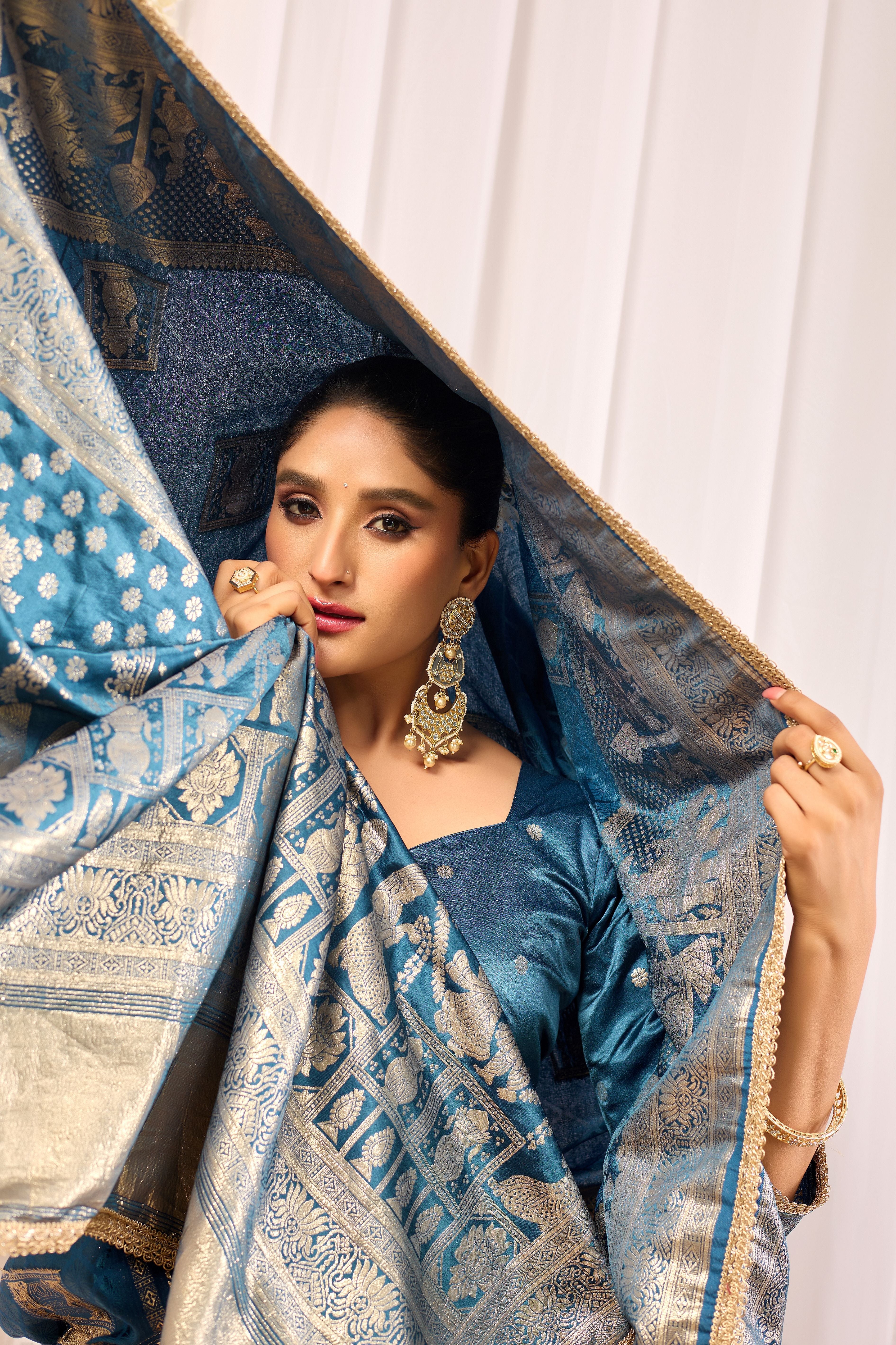 Teal Blue Soft Silk Saree with Intricate Woven Motifs, Rich Zari Border and Designer Traditional Pallu