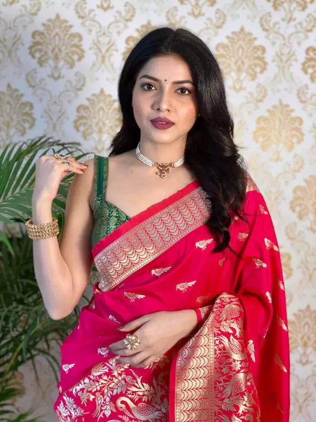Close-up of the exquisite golden zari work on a Banarasi Pure Silk Pink Saree
