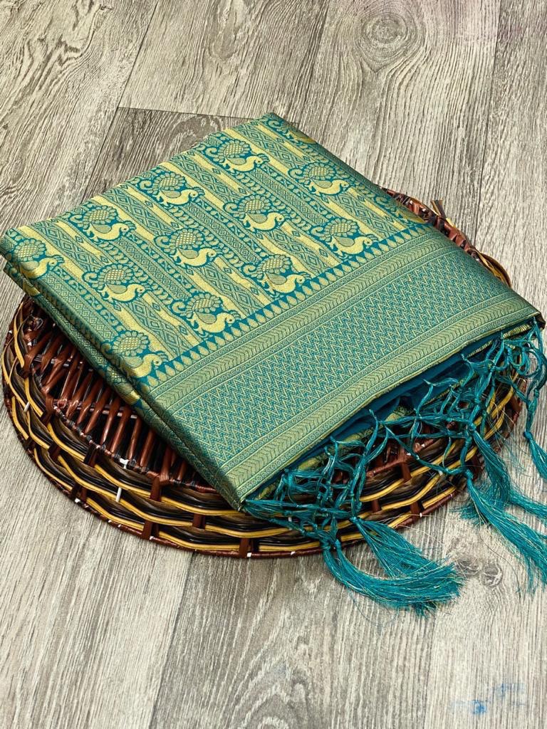 green silk saree with tassels