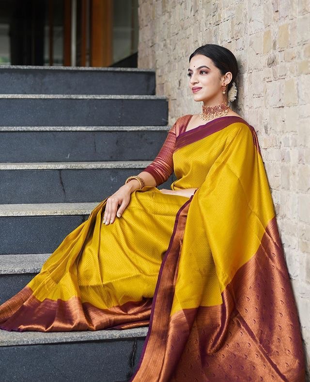 yellow self design zari weaving saree
