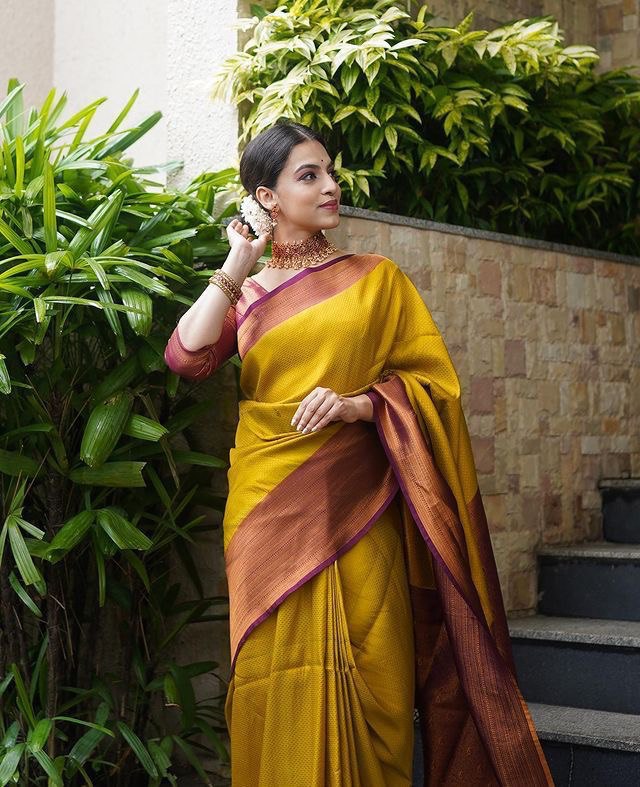 yellow self design pure silk saree
