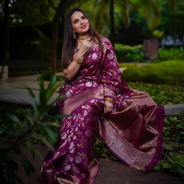 Detailed view of the floral print on a wine Banarasi soft silk saree