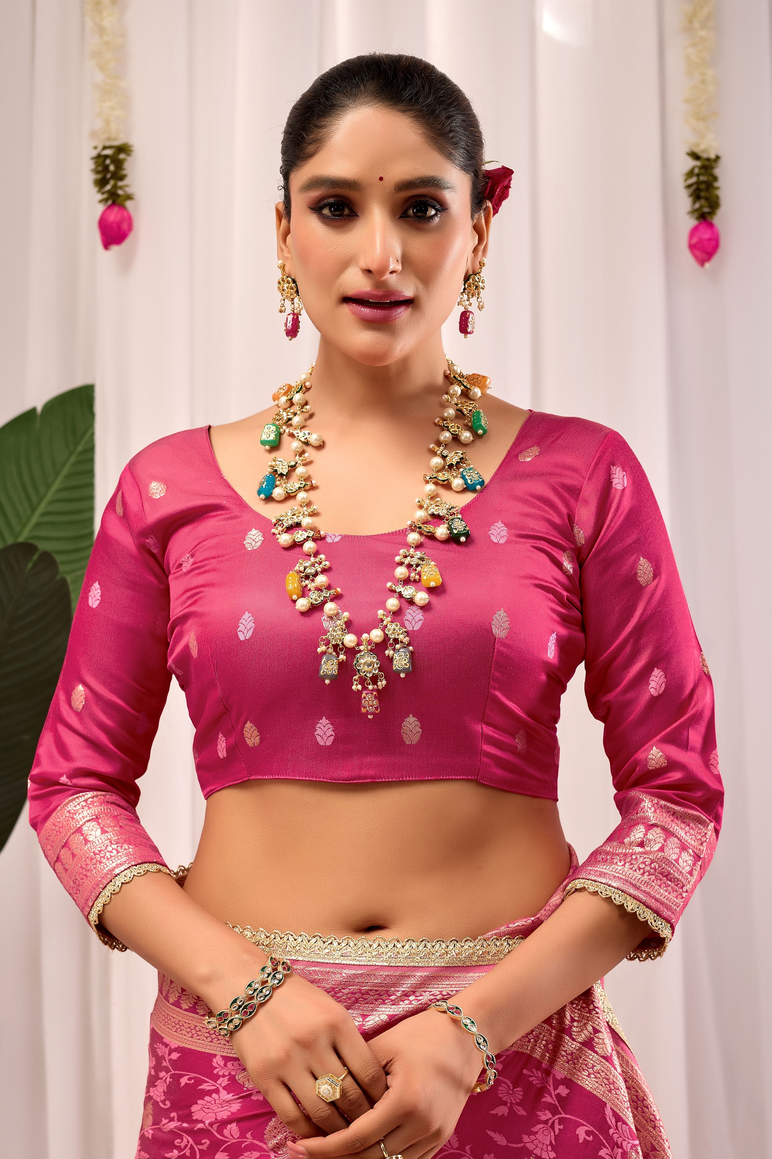 Elegant Rose Pink Floral Saree Featuring Traditional Motifs and Rich Zari Border for Festive Occasions