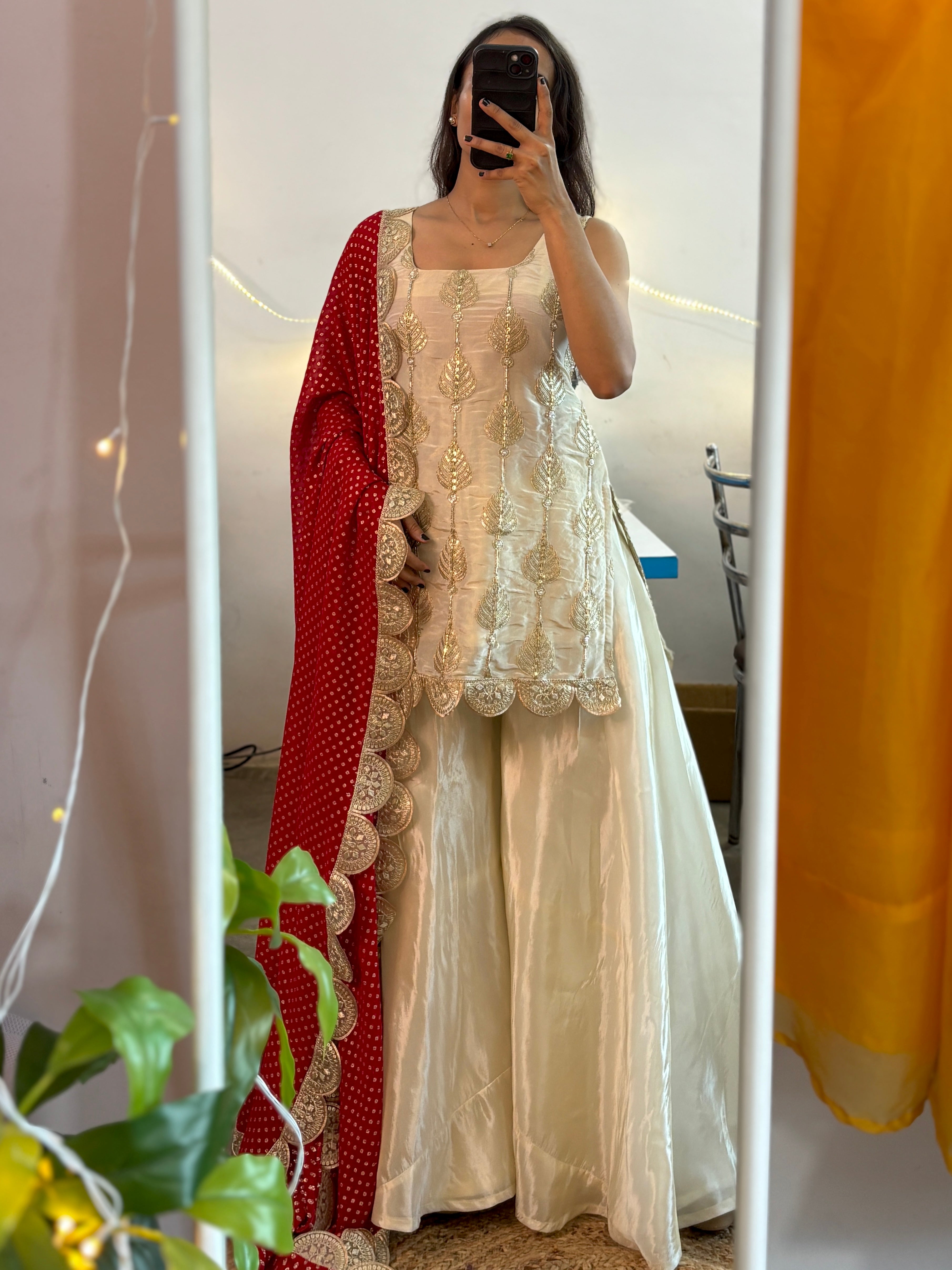 White sharara suit with Red Bandhej Dupatta,