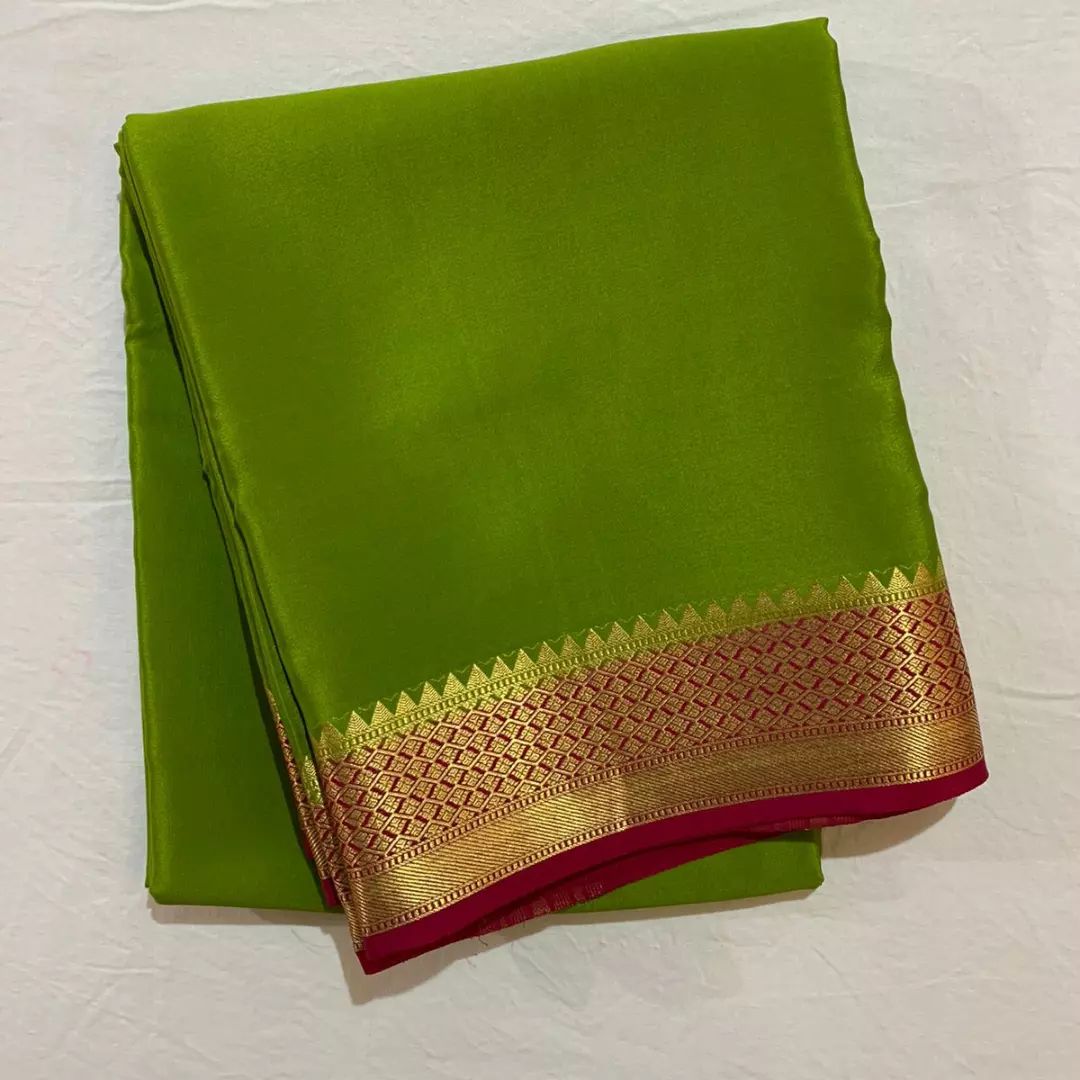 Mysore Silk Saree In Mehendi Green With Zari Border.