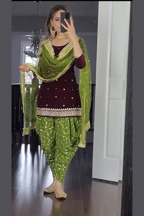 Partywear dhoti patiyala suit and dupataa set.