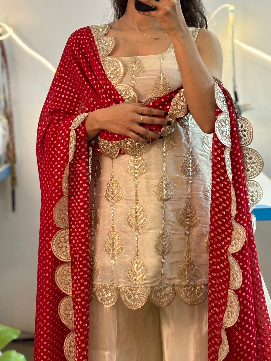 White sharara suit with Red Bandhej Dupatta,