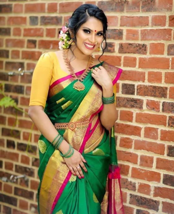 Rama green color paithani silk saree with golden zari weaving work