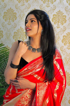 Garnet Red Banarasi Soft Silk Saree Enhanced with Detailed Zari Weaving