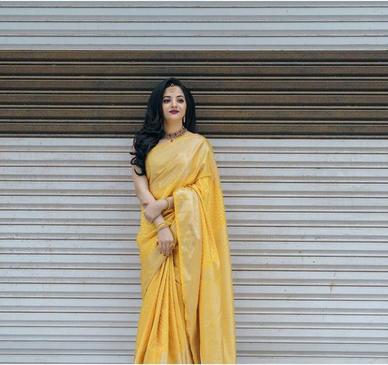 yellow banarasi soft silk jacquard saree with beautiful tassels